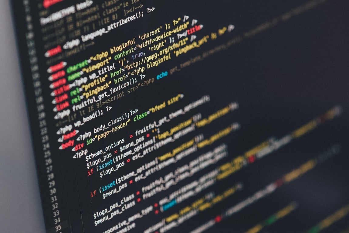 Abstract shot of computer code on a screen by Pexels from Pixabay